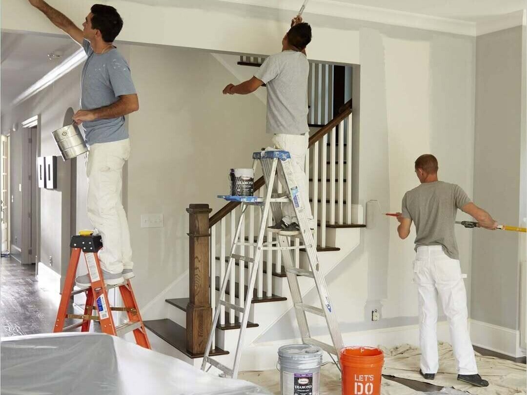 Professional painters and decorators working on residential project